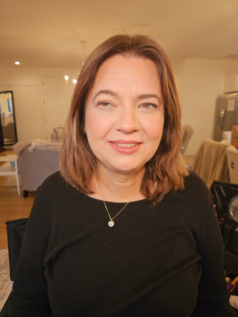 Woman with reddish-brown hair smiling, Pro-Age beauty portrait